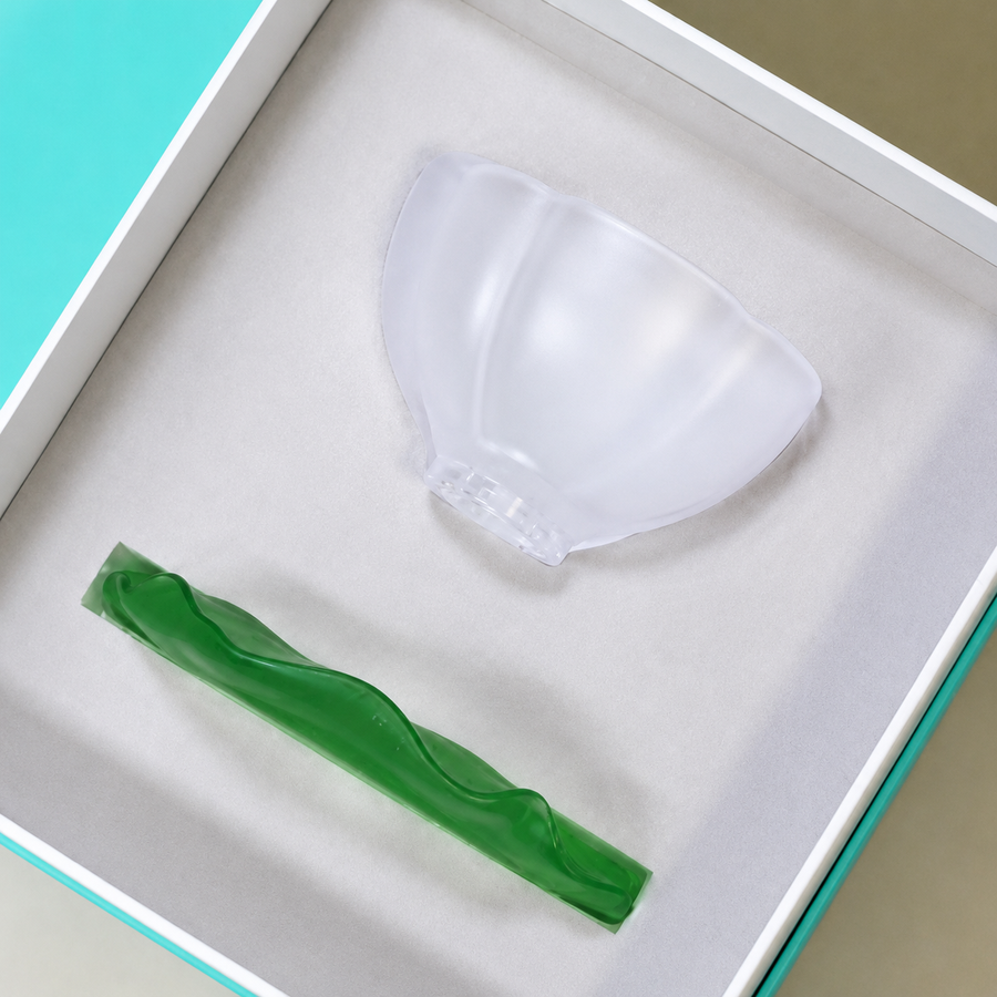 A premium gift box featuring the frosted petal teacup and green lotus leaf saucer, securely nestled in a soft protective lining for a high-end gifting experience.