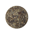 6-year-aged Laifeng Vine Tea cake from Hubei, China, featuring naturally fermented herbal tea leaves with a rich aged character and traditional craftsmanship