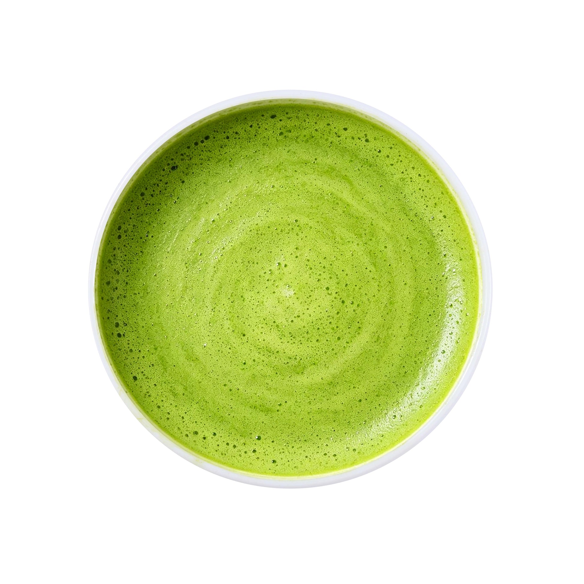 Ceremonial matcha green tea powder brewed into a vibrant green tea drink with smooth foam texture and fresh natural color