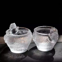 A charming pair of handcrafted cat-themed glass teacups with sparkling ice-crackle texture, perfectly presented as a unique gift set for cat lovers.