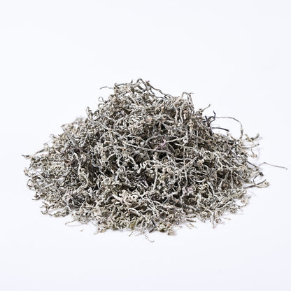 Close-up of dried Teng Cha (Vine Tea) leaves showing the characteristic white frost coating, indicating high active botanical ingredients.