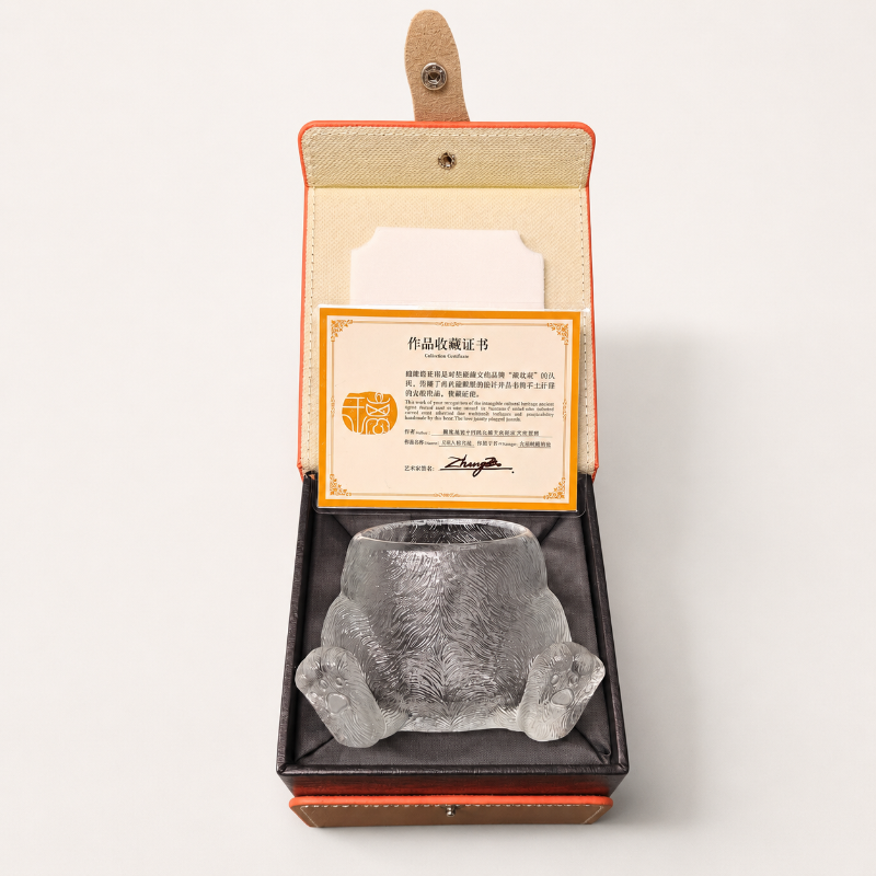 Clear glass cat paw teacup presented in a premium gift box with a collectible certificate.