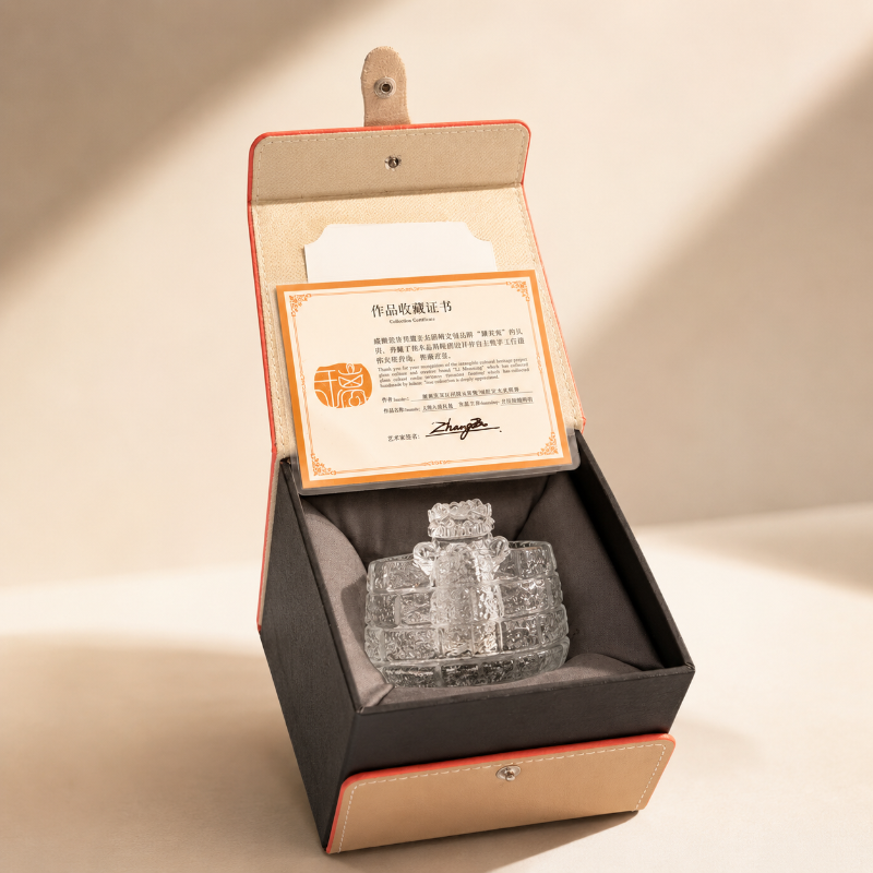 Guardian lion glass tea cup presented in a premium gift box with a collectible certificate.