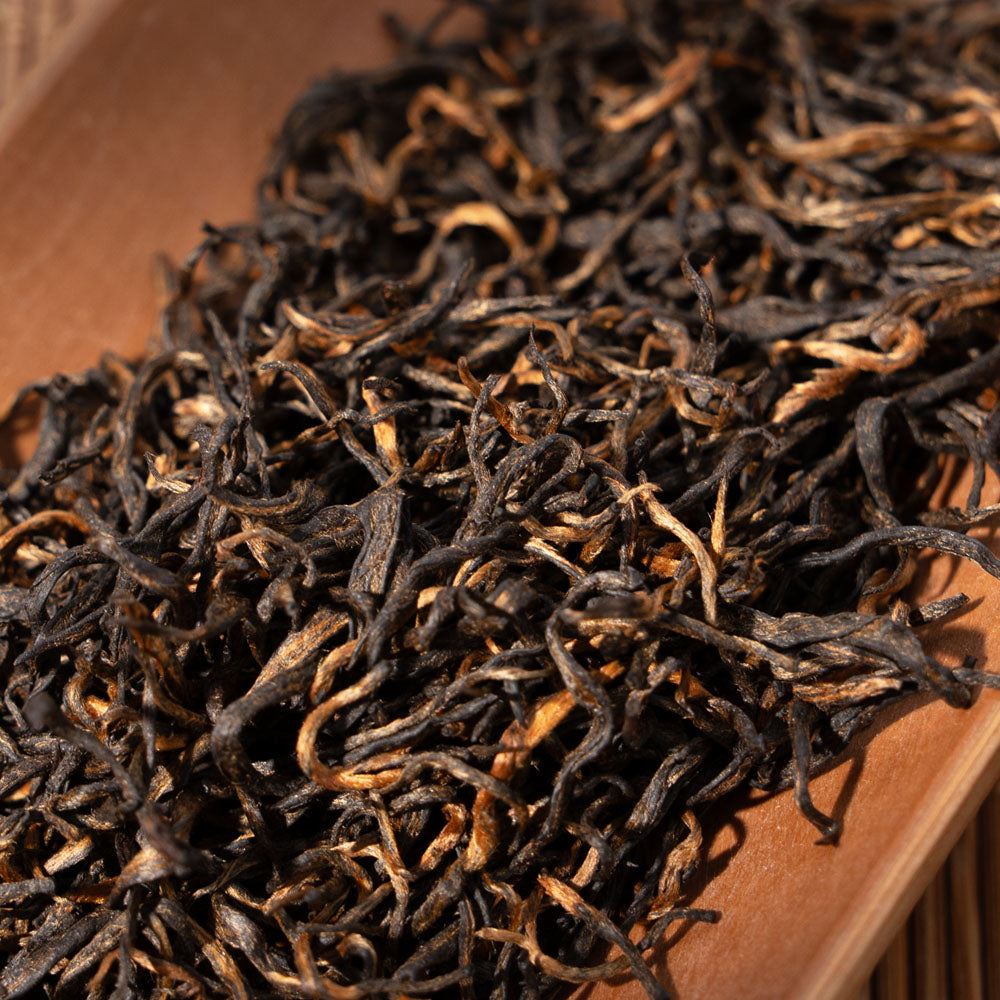 Close-up of premium Jinjunmei black tea leaves