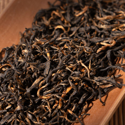 Close-up of premium Jinjunmei black tea leaves