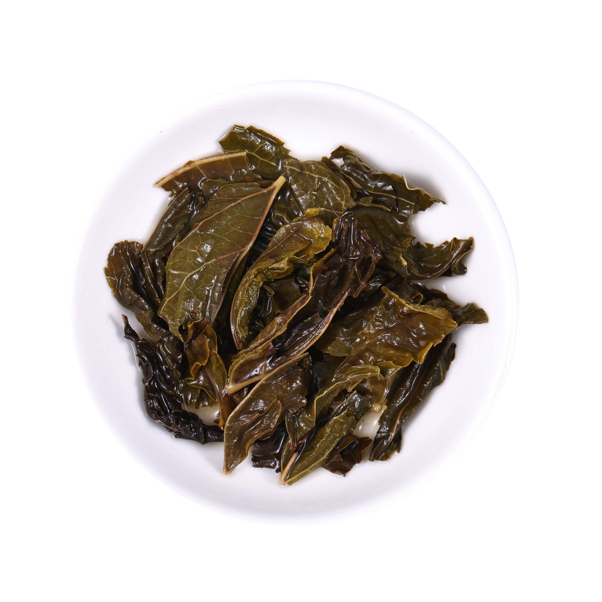 Laifeng Vine Tea large leaf infused leaves from Hubei, China, featuring fully expanded herbal tea leaves with natural texture and deep green color after brewing