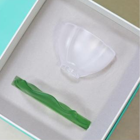 A premium gift box featuring the frosted petal teacup and green lotus leaf saucer, securely nestled in a soft protective lining for a high-end gifting experience.