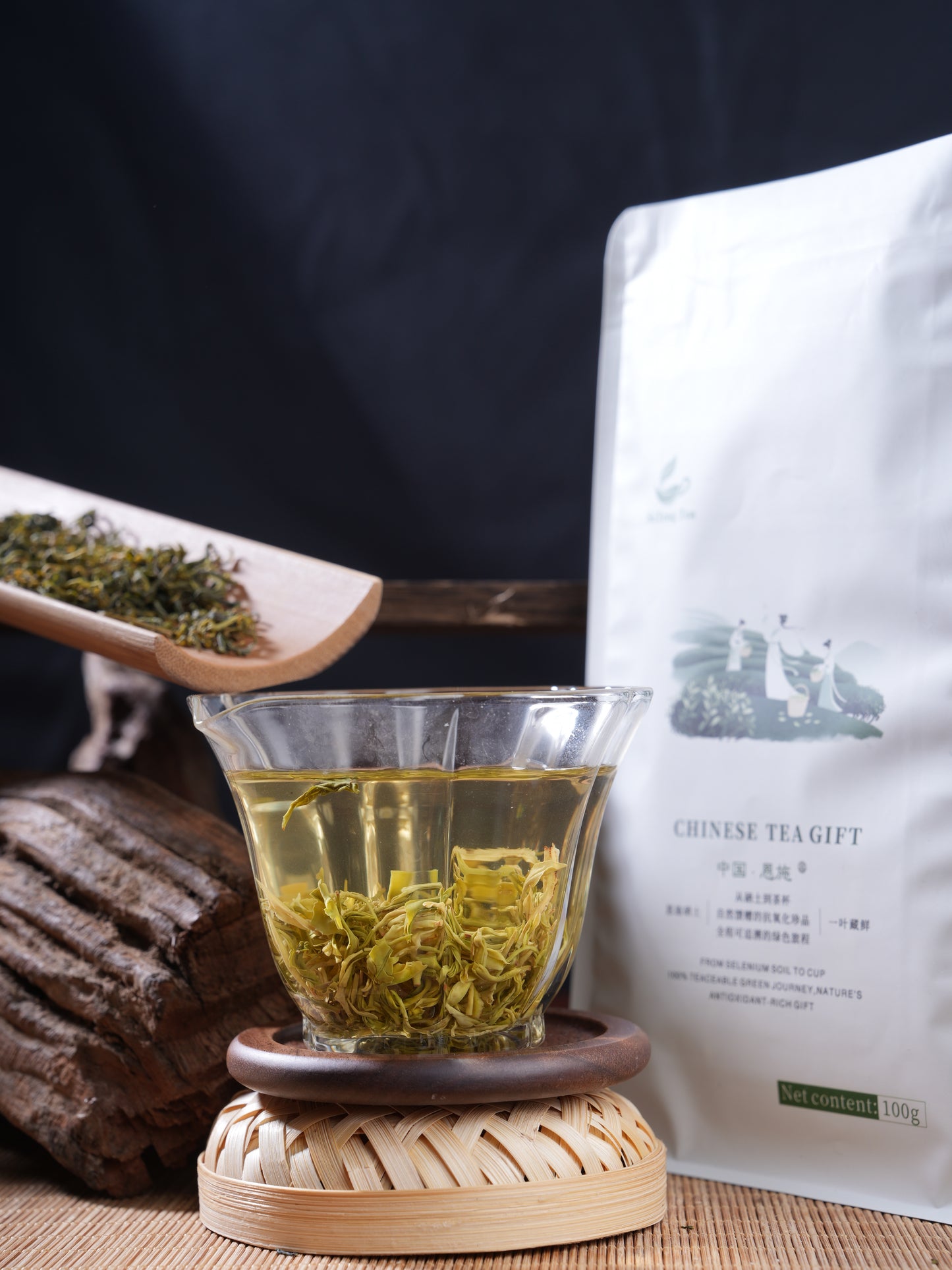 SeTeng Tea 100g premium loose leaf white tea pouch, elegantly showcased with a freshly brewed glass displaying large, natural leaves.