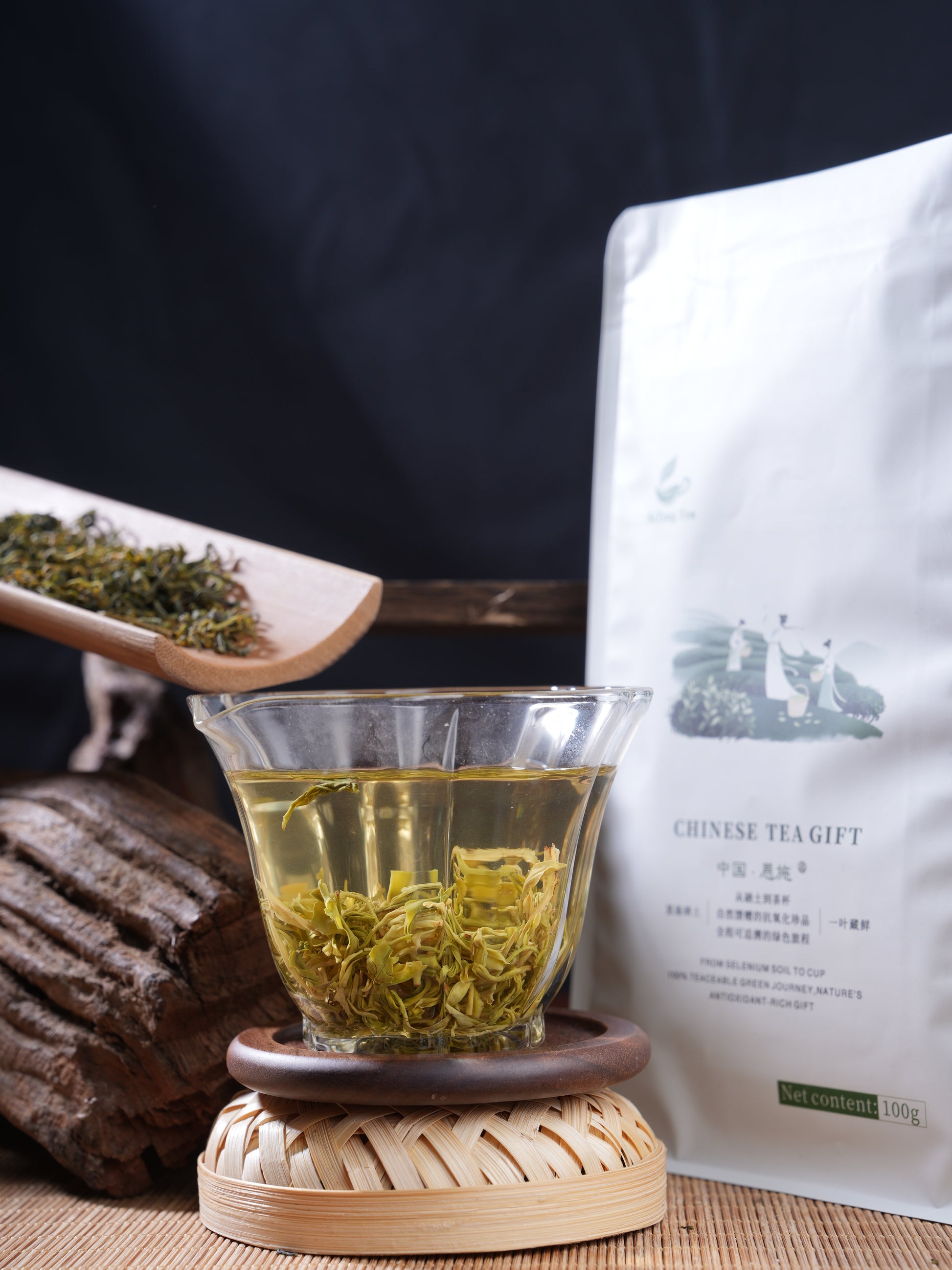 SeTeng Tea 100g premium loose leaf white tea pouch, elegantly showcased with a freshly brewed glass displaying large, natural leaves.