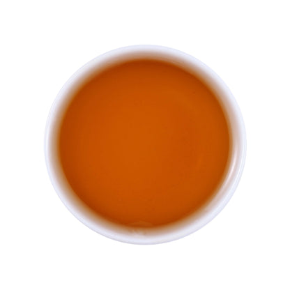 Six-year aged fermented vine tea liquor showing clear amber tea color and rich aged flavor characteristics from Laifeng, Hubei, China