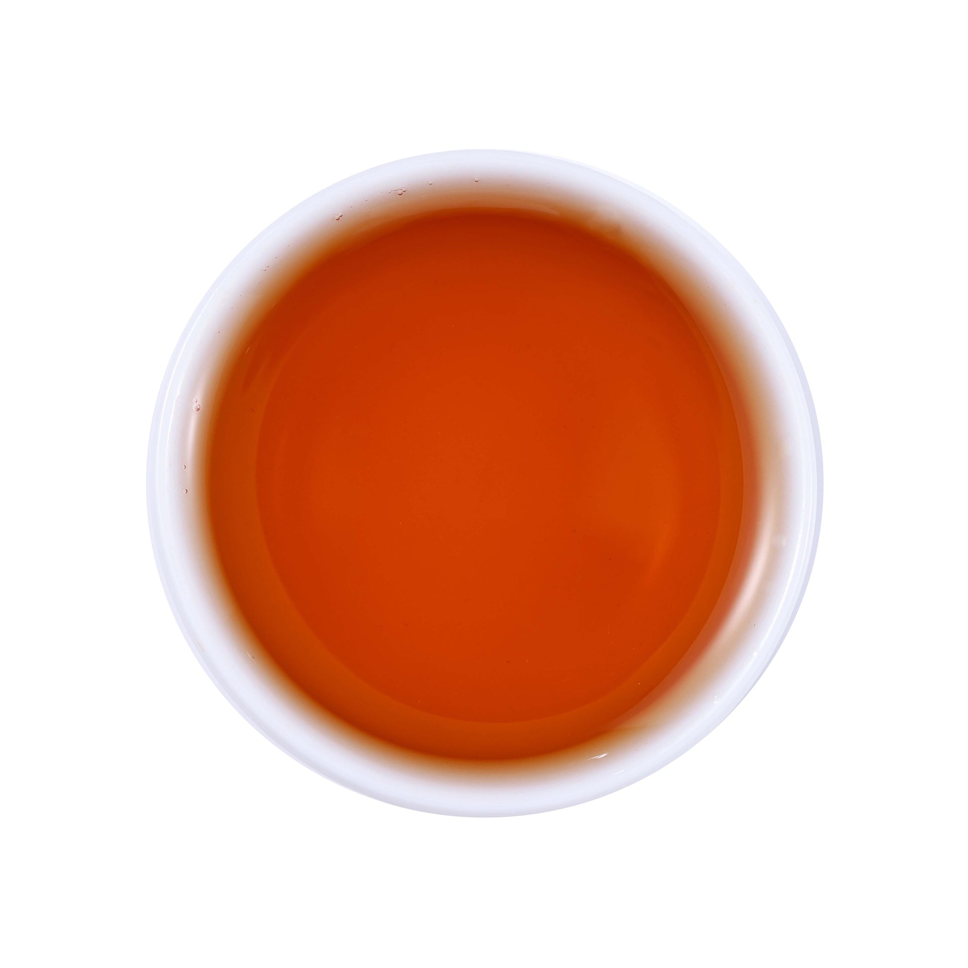 Wild black tea brewed tea soup showing clear amber-red liquor color with rich depth and natural brightness from Enshi, Hubei, China
