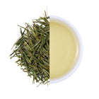 Premium Xianfeng Anji Bai Cha Green Tea from Hubei, China, featuring delicate needle-shaped tea leaves and a clear light yellow-green tea infusion