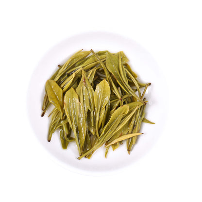Xianfeng Anji white tea infused leaves showing fresh tender leaf shape and bright yellow-green color after brewing
